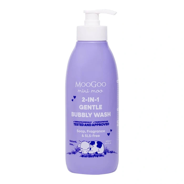 A bottle of MooGoo Mini Moo 2-in-1 Gentle Bubbly Wash soap and fragrance wash, featuring a light purple body, white pump dispenser, and blue text and illustrations on a white background.