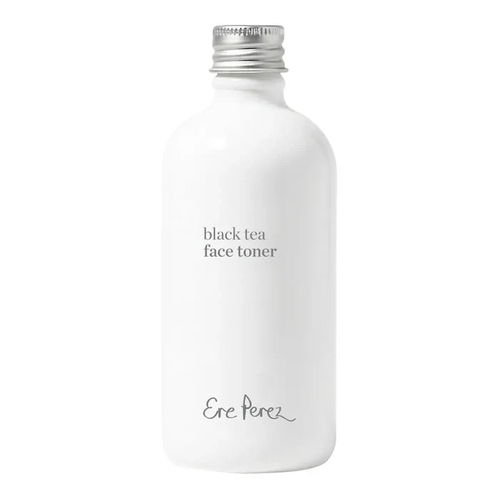 White cylindrical bottle of Black Tea Face Toner with a silver screw on lid.