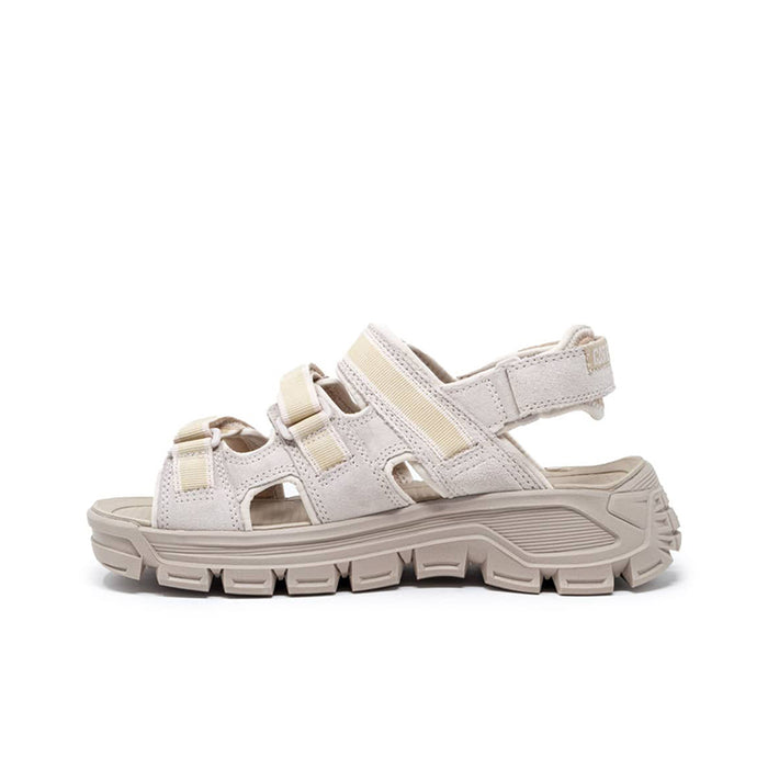 Women’s white leather sport sandals with adjustable straps and chunky treaded outsole