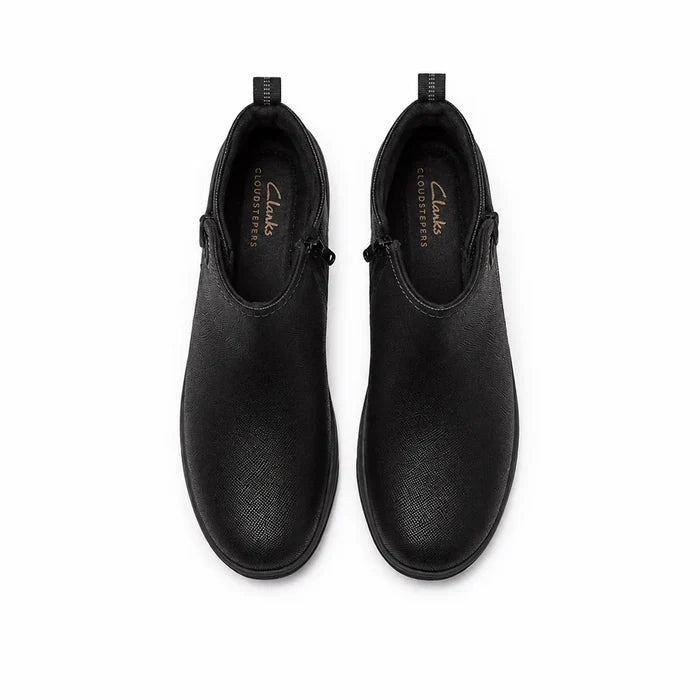 Pair of black ankle boots with side zip, rounded toe, and textured leather uppers