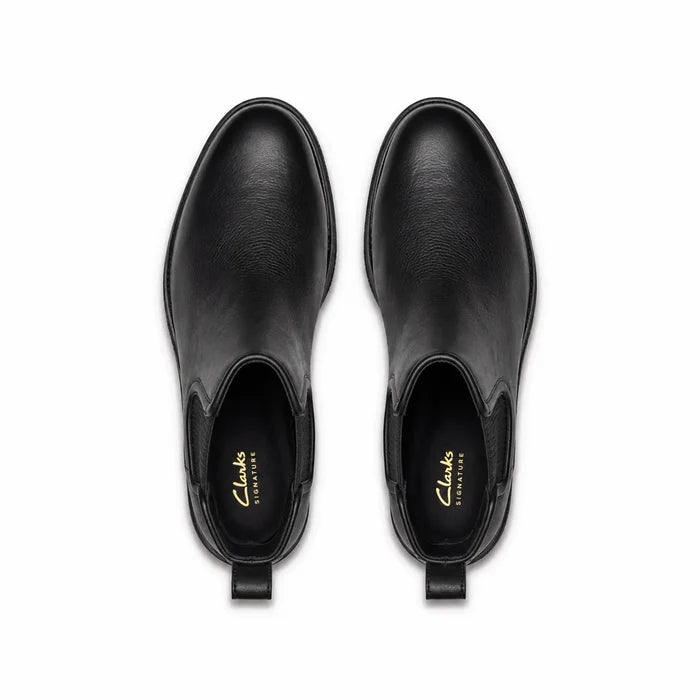 Pair of black leather chelsea ankle boots with elastic gore and cushioned footbed
