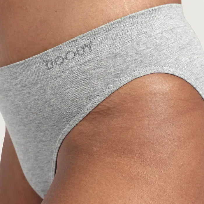 Close-up of a person wearing light heather gray underwear, showing the waistband with the brand name BOODY printed in gray.