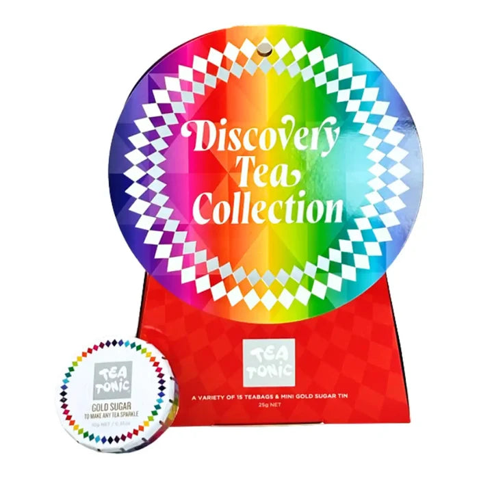 Tea Tonic Discovery Tea Collection gift set featuring a large circular rainbow-colored sign, a red tin box, and a small round tin of cold sugar tea sparkle on a white background.