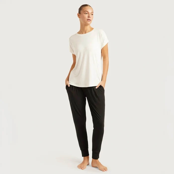 A woman modelling Boody's Downtime Lounge Pants in Black with a casual white t-shirt.