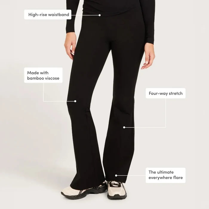 Black high-rise flare pants shown on a model from the waist down, with text callouts highlighting features.