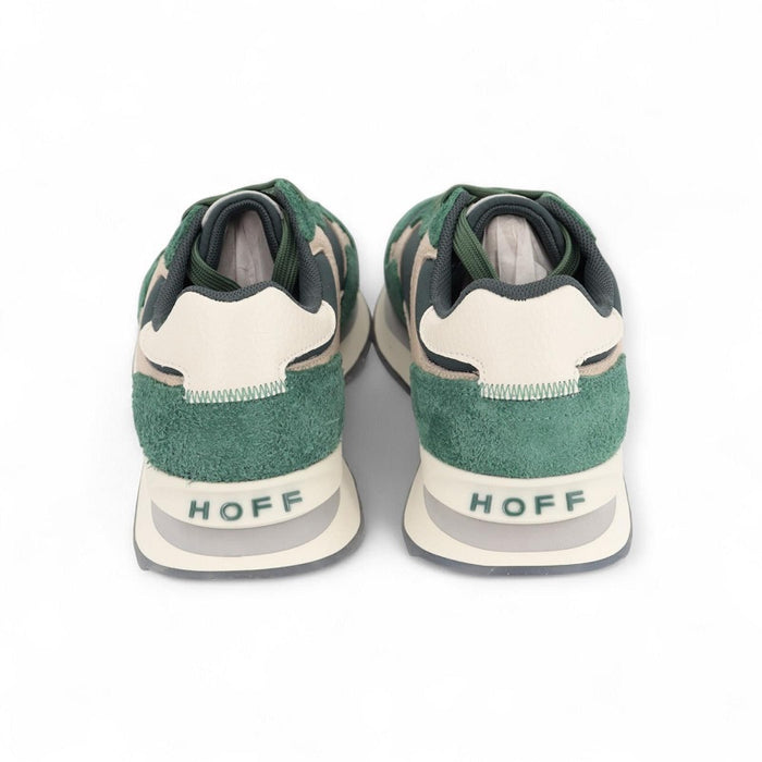 Back view of green suede sneakers with HOFF heel logo and off-white sole