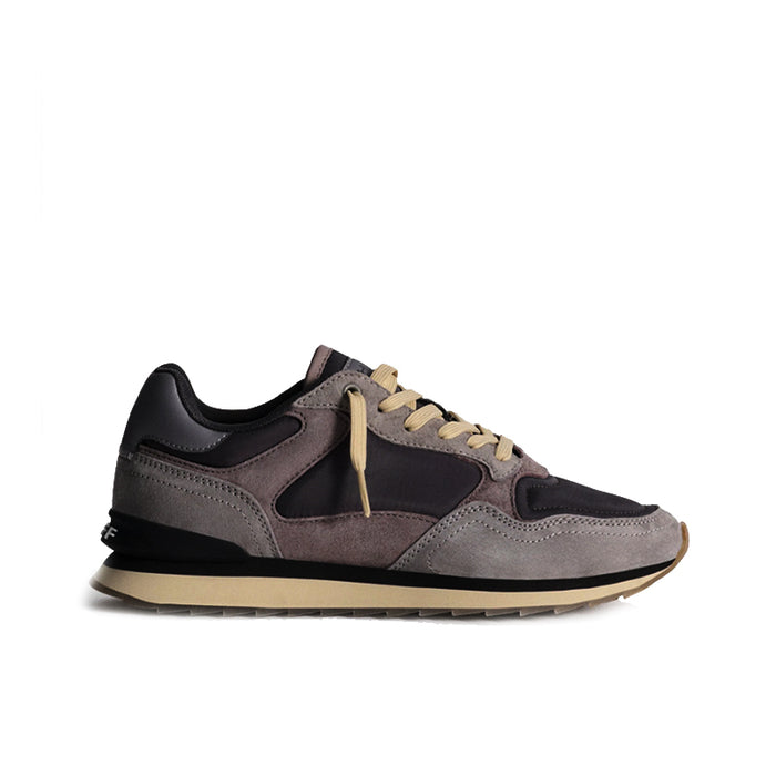 Multicolor leather women's casual sneaker with black trim and tan rubber outsole.
