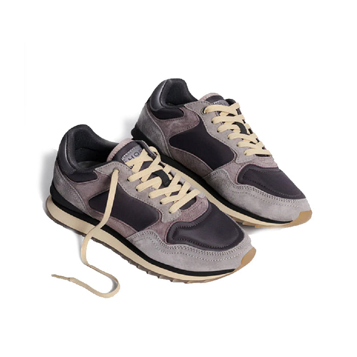 Pair of multicolor leather women's sneakers with beige laces and dark side panels.