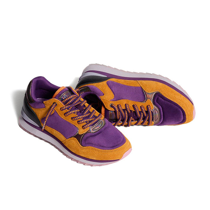 Side view of purple and orange lace-up sneakers with textured sole and padded collar