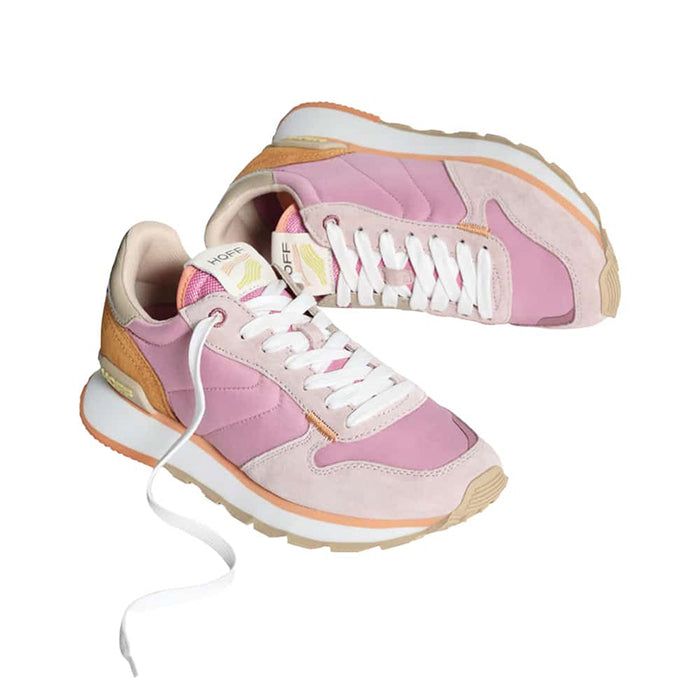 Women’s track-style sneakers in pink with white laces and tan-orange heel accents