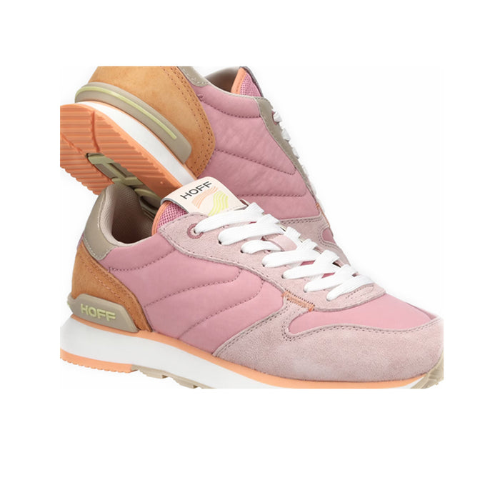 Women’s sneakers side view in pink and light gray with tan-orange heel and white sole