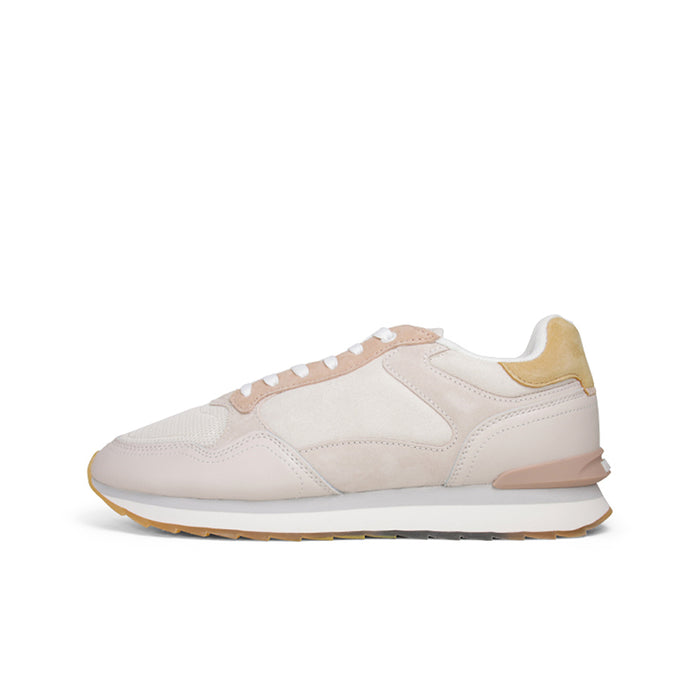 Beige women's casual sneakers with white laces, stitched panels, and gum outsole
