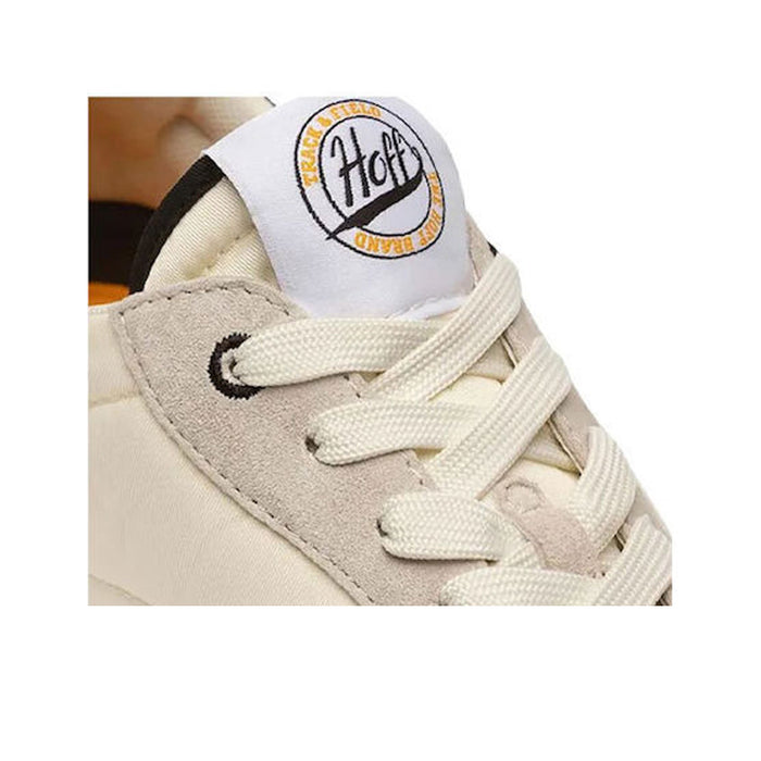 Men's leather sneaker close-up: cream laces with HOFF logo patch on the tongue