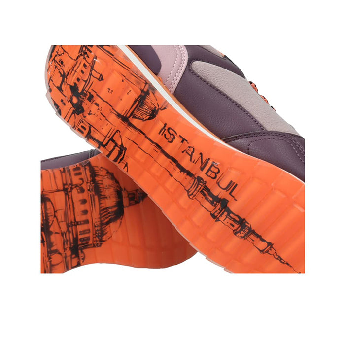 Orange and dark gray sneaker outsole with graphic tread and 'ISTANBUL' text