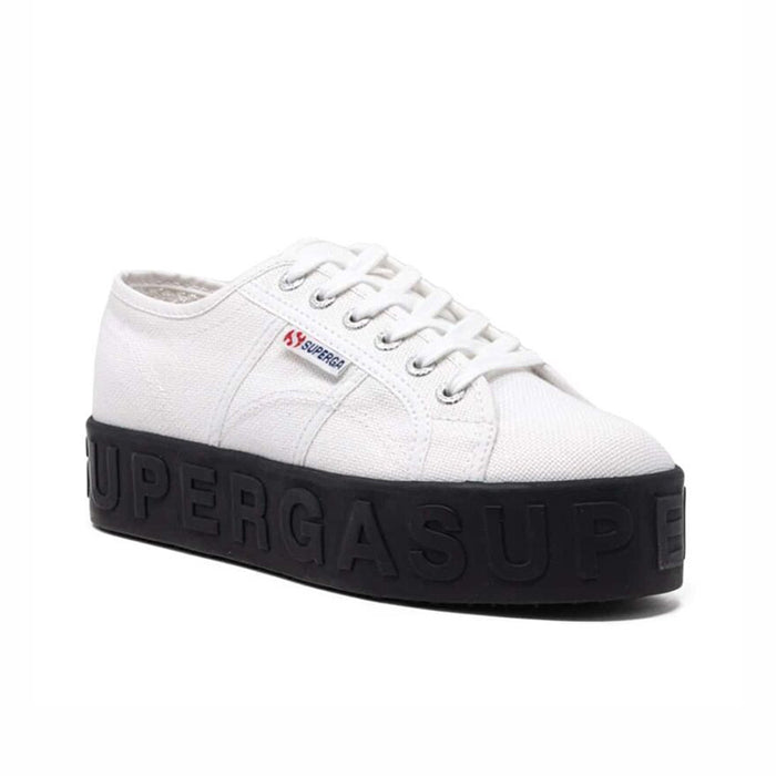 Women’s white lace-up low-top sneakers with textured dark outsole and 3D lettering