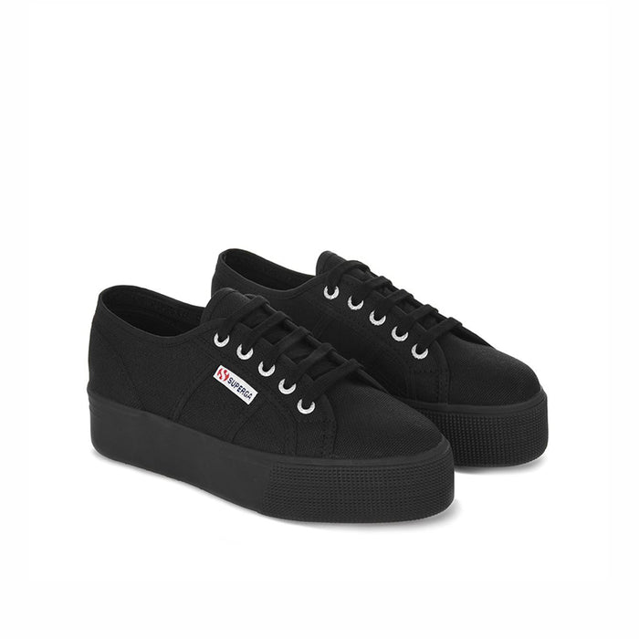 Pair of black lace-up canvas sneakers with thick rubber platform sole