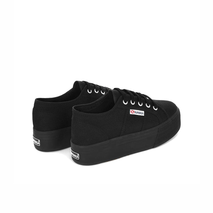 Black canvas low-top sneakers with rear heel tab and cushioned platform sole