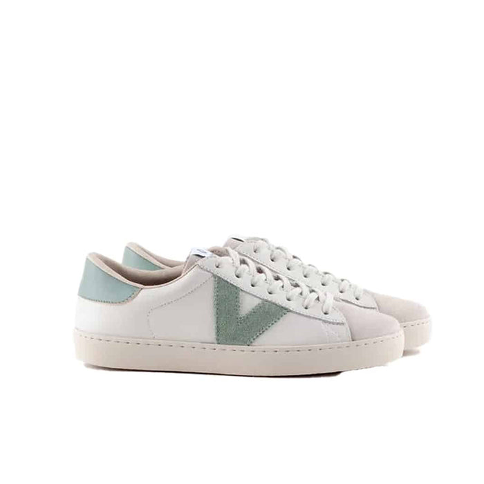 Pair of low-top sneakers with white uppers, teal triangular panels, lace-up design