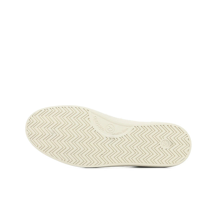 Shoe outsole with light beige rubber and zigzag tread pattern