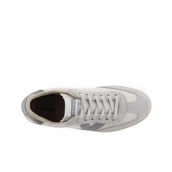 Low-top lace-up sneakers, side view with visible laces and interior lining
